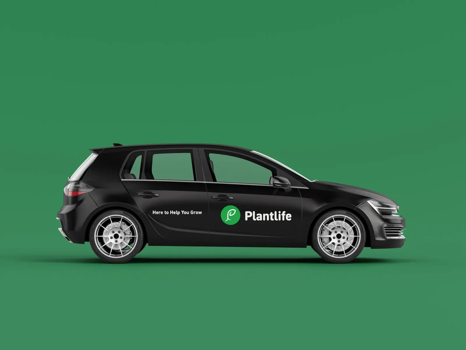 A black hatchback with Plantlife door branding on a green background.