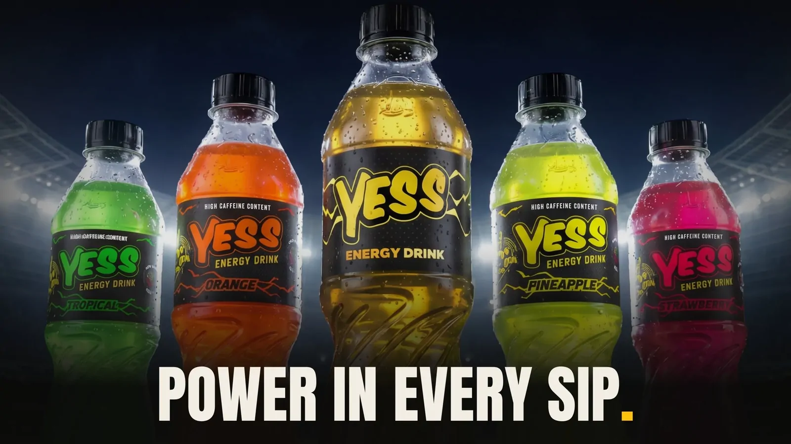 Five YESS Energy Drink bottles under stadium lights with the line Power in every sip.